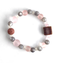 Load image into Gallery viewer, Pink Glass and Mother of Pearl beads are set off by a complementary glass accent bead and pink lava stone. Apply 1-2 drops of your favorite essential oil to your lava bead    Size: 6
