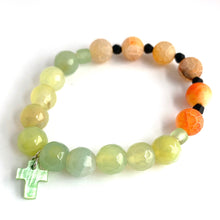 Load image into Gallery viewer, Beautiful expression of faith. Orange Crackle beads and green Agates, with green glass accent beads and cross. Stretch bracelet Size 6 1/2
