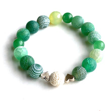 Load image into Gallery viewer, Breathe deep your favorite earthy essential oil applied to your white Lava bead. Picture the green hills as you look upon the rich greens of Aventurine and Agates. Silver hearts envelope the white Lava bead.   Type: Diffuser Stretch Bracelet Size: 6 Bead sizes: 8mm, 10mm
