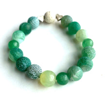 Load image into Gallery viewer, Breathe deep your favorite earthy essential oil applied to your white Lava bead. Picture the green hills as you look upon the rich greens of Aventurine and Agates. Silver hearts envelope the white Lava bead.   Type: Diffuser Stretch Bracelet Size: 6 Bead sizes: 8mm, 10mm
